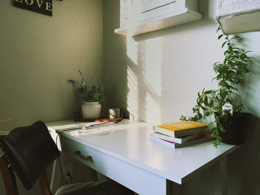 Standing desk setup with adjustable monitor arm and proper keyboard-mouse positioning