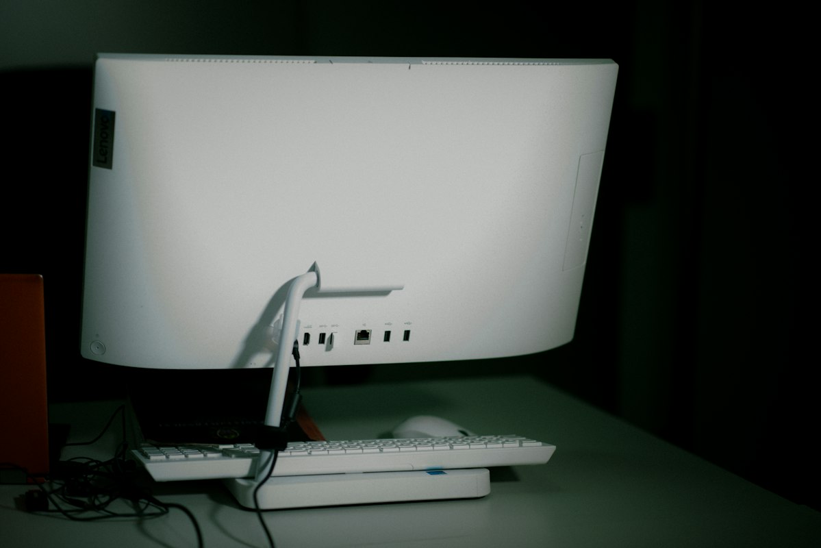 Dual monitor setup with ergonomic chair and organized filing system