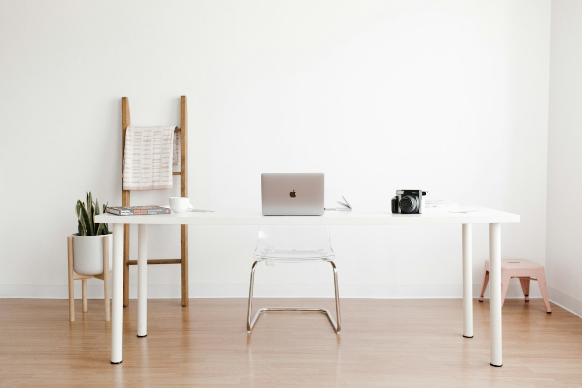 Standing desk workspace with anti-fatigue mat and accent lighting